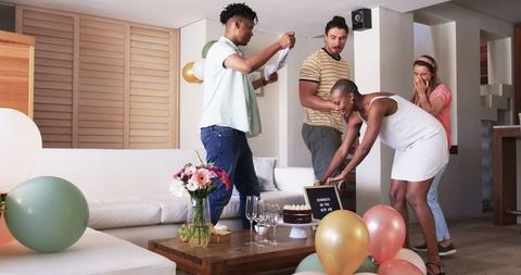 Friends Celebrating at Home with Gifts and Decorations