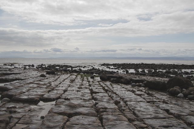 Rocky Shoreline with Cloudy Sky - Download Free Stock Images Pikwizard.com