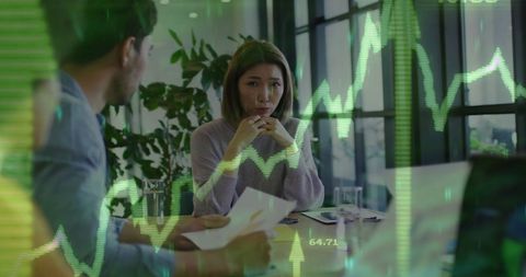 colleagues discussing financial data amidst graph overlay - Download Free Stock Images Pikwizard.com