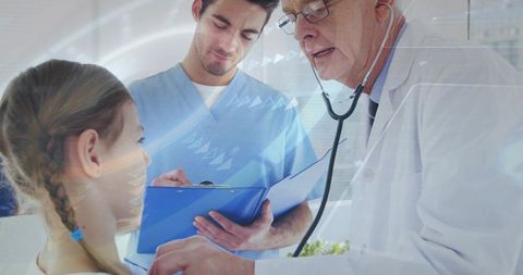 Doctor listening with stethoscope to child while nurse recording notes at pediatric checkup