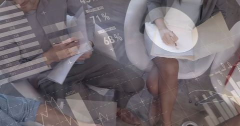 Business Meeting Analyzing Data with Digital Technology Overlay