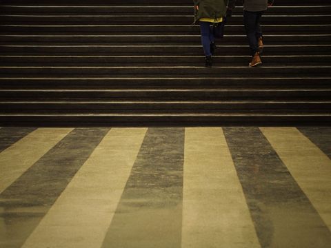 People ascending stairs in urban setting