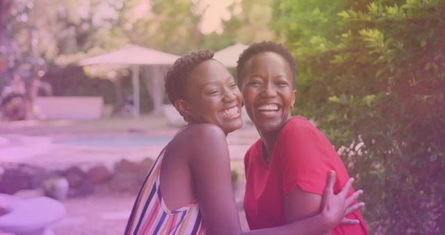 Joyful Sisters Embracing at Vacation Resort Outdoor Area - Download Free Stock Images Pikwizard.com