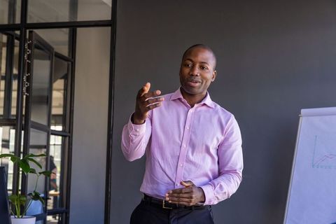 Business Professional Presenting in Office Meeting