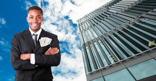 Digital composite image of successful businessman standing with currency in pocket