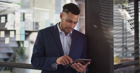 Businessman Analyzing Data on Tablet - Download Free Stock Images Pikwizard.com