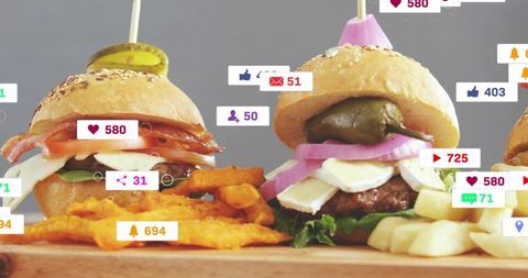 Gourmet slider trio on wooden board featuring fries, waffle fries and social overlays