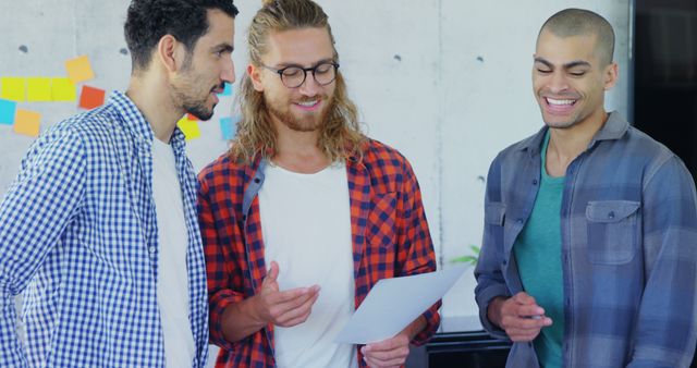 Diverse Male Team Collaborates on Creative Project in Modern Office - Download Free Stock Images Pikwizard.com