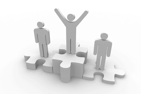 Three stylized figures on puzzle podium on transparent surface