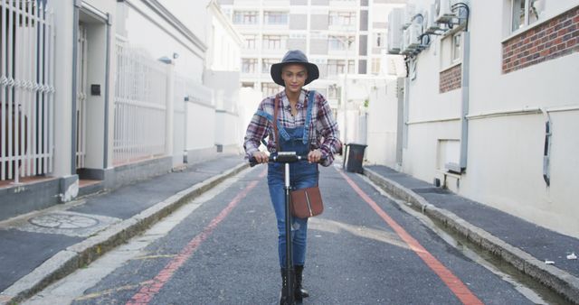 Young Woman Riding Electric Scooter in Urban Street - Download Free Stock Images Pikwizard.com