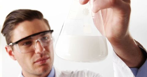 Scientist Analyzing Liquid in Flask in Laboratory - Download Free Stock Images Pikwizard.com