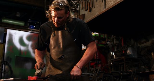 Skilled Blacksmith Forging Iron in Workshop - Download Free Stock Images Pikwizard.com