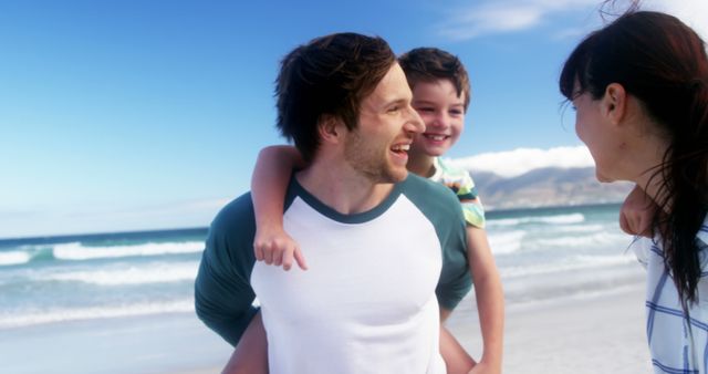 Happy Family Enjoying Beach Day, Smiling and Playing Together - Download Free Stock Images Pikwizard.com