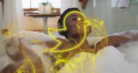 Relaxing wellness: woman enjoying foam bath with headphones