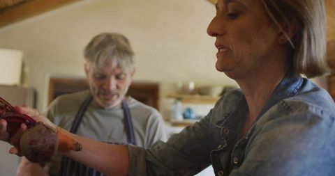 Couple Preparing Fresh Beets in Cozy Farmhouse Kitchen