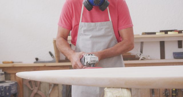 Woodworker Sanding Surfboard in Workshop - Download Free Stock Images Pikwizard.com