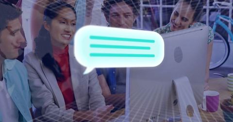 Diverse Team Collaborating on Desktop Project in Modern Office