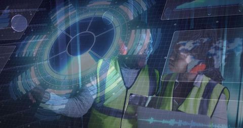 Engineers analyzing holographic data with tablet wearing safety vests in control room