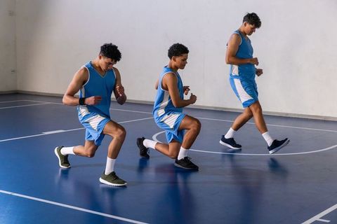 Basketball Team Practicing Front Lunges for Fitness