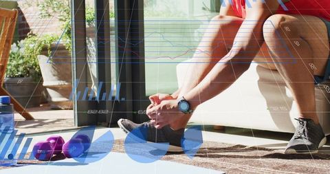 Man tying running shoes on patio couch with dumbbells water bottle and analytics overlay