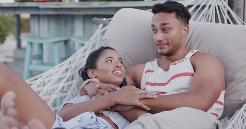 Couple Relaxing Together in Hammock at the Beach
