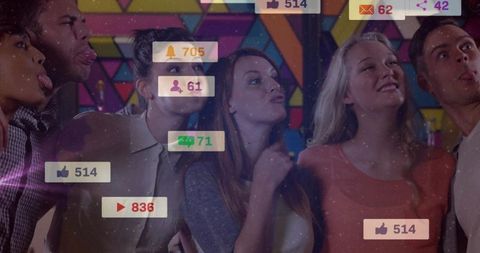 Young friends posing playfully with social media reaction badges at colorful geometric wall