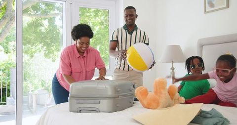 Family Packing Suitcase for Fun Vacation at Home with Happiness