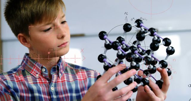 Young Student Examining Molecular Model in Science Classroom - Download Free Stock Images Pikwizard.com