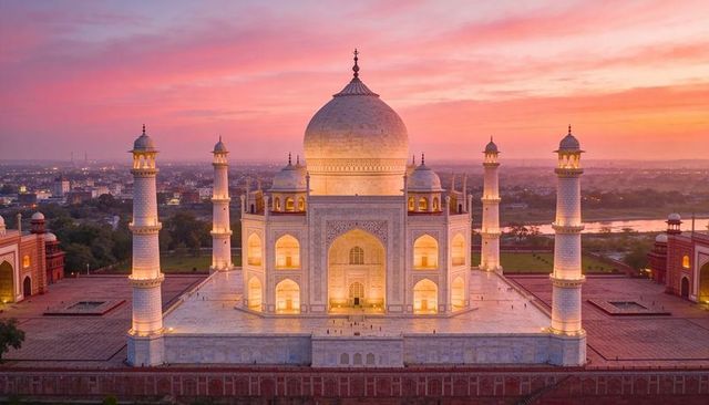 Taj mahal at sunset glowing marble mausoleum dome and four minarets agra india