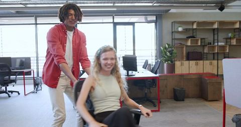 Colleagues enjoying workspace collaboration in modern office