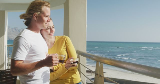 Young Couple Enjoying Coffee on Balcony Overlooking Ocean - Download Free Stock Images Pikwizard.com