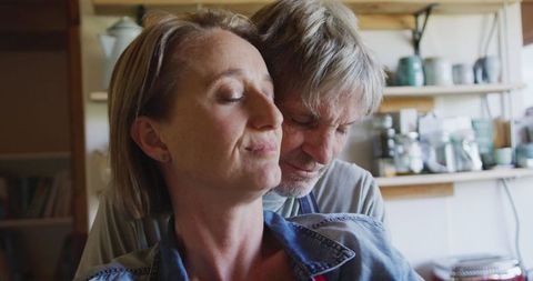 Senior Couple Embracing in Cozy Kitchen