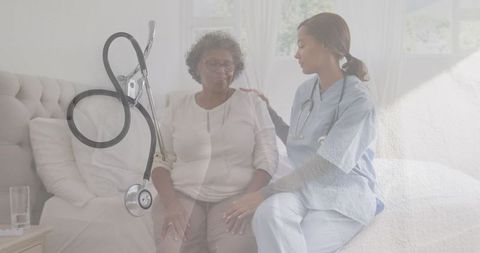 Nurse Comforting Senior Patient in Sunny Room with Stethoscope Overlay - Download Free Stock Images Pikwizard.com