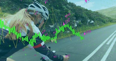 Cyclist Monitors Riding Performance Data on Mountain Road Journey