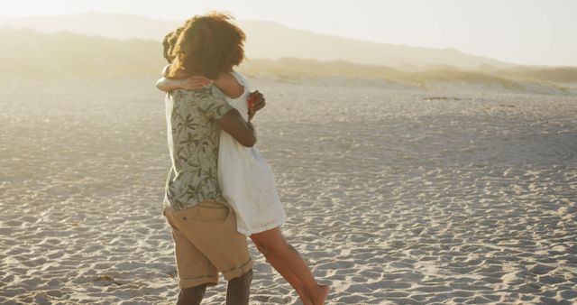 Romantic diverse couple embracing on beach at sunset. Summer, free time, love, romance and vacations.