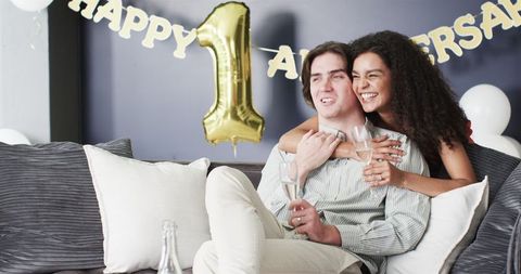 Joyful Couple Celebrates Anniversary with Champagne Toasts