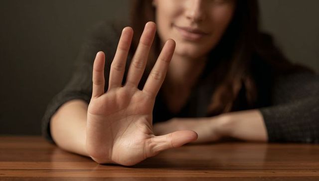 Female Hand Raising Gesture in Minimalist Interior