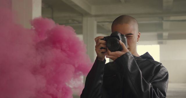 Young Photographer Capturing Urban Scene with Pink Smoke - Download Free Stock Images Pikwizard.com