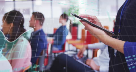 Business Meeting with Financial Data Overlay Analyzing Trends