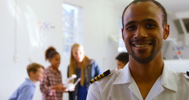 Pilot Instructor Smiling in Classroom with Students - Download Free Stock Images Pikwizard.com