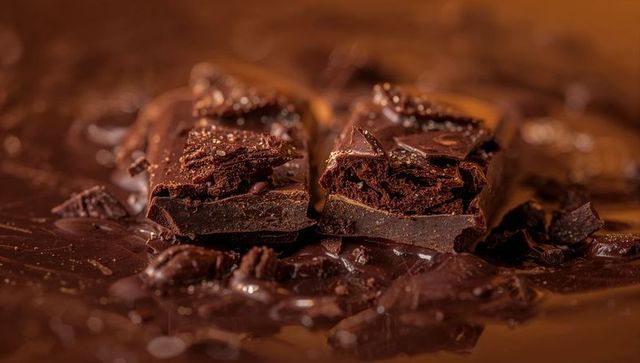 Decadent dark chocolate chunks in melted chocolate base