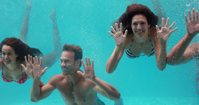 Friends Swimming Underwater in Pool - Download Free Stock Images Pikwizard.com