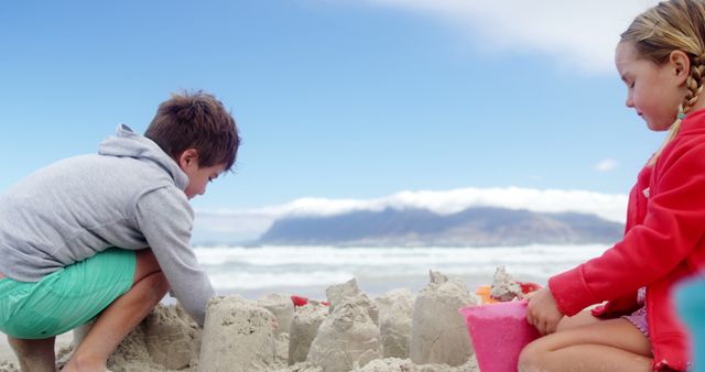Children Building Sandcastles on Sandy Beach in Summer - Download Free Stock Images Pikwizard.com