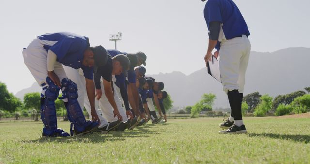 Baseball Team Practicing Stretching Outdoors on a Sunny Day - Download Free Stock Images Pikwizard.com