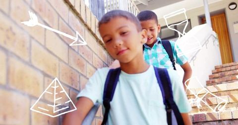 Two schoolboys walking down brick steps with backpacks and playful white doodles