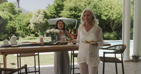 Women Socializing at Elegant Outdoor Wedding Reception