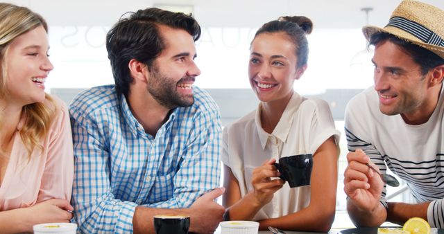 Group of Smiling Young Friends Having Coffee in a Cafe - Download Free Stock Images Pikwizard.com