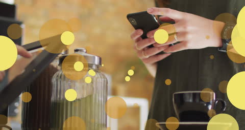 Hands Using Mobile Payment at Coffee Shop with Digital Graphics Overlay