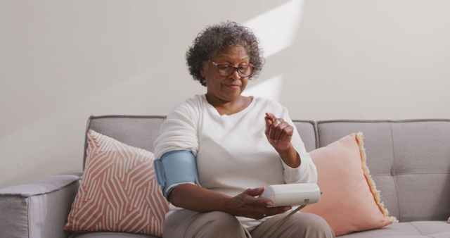 Senior Woman Checking Blood Pressure with Home Monitoring Device - Download Free Stock Images Pikwizard.com