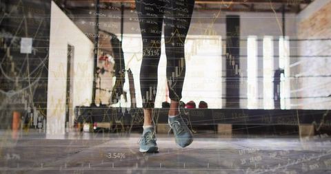 Woman jumping in industrial loft gym with stock market graph overlay showing momentum